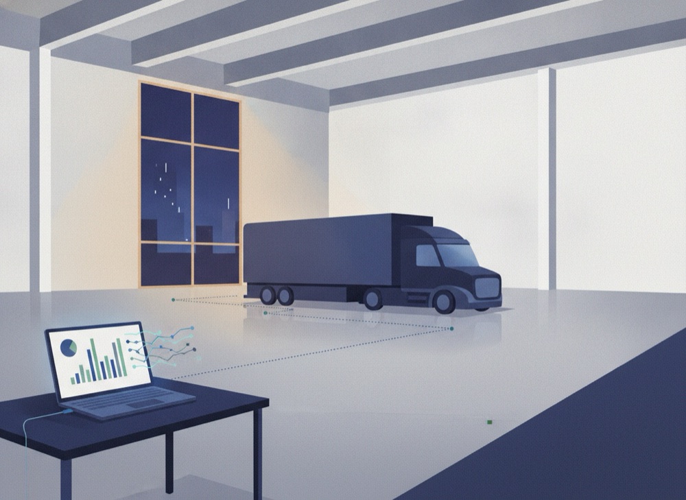 Transport manager analysing driver data on a laptop